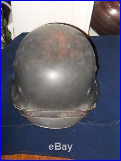 Black 1941 german ww 2 helmet withlinner. Chin strap marked 1941. You decide