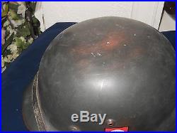 Black 1941 german ww 2 helmet withlinner. Chin strap marked 1941. You decide