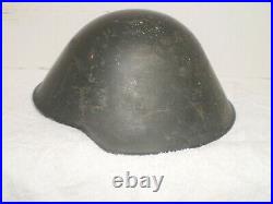 East German DDR M56 helmet, WW2 type liner, stamped ll/57. Size 57