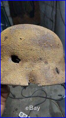 German WW2 Helmet Dug with a bullet hole