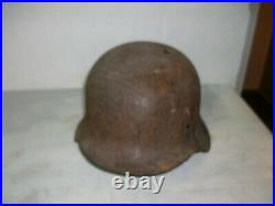 German steel helmet M42 from WW2 Ardenne Forest with shrapnel damage