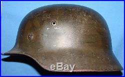 NICE WW2 GERMAN M-35 RE-ISSUED HELMET WITH CAMOUFLAGE PAINT