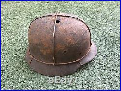 WW2 German combat helmet M40 with an original metal camouflage mesh. Size 65