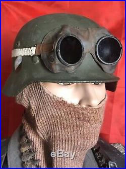 WW2 German helmet M35 and motorcycle goggles. The helmet is restored. Size 67
