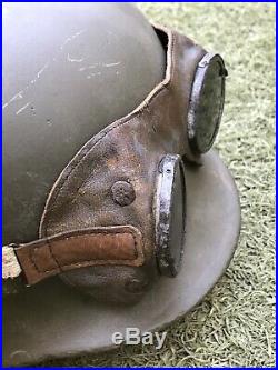 WW2 German helmet M35 and motorcycle goggles. The helmet is restored. Size 67