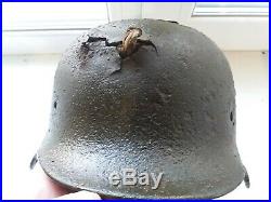 WW2 Helmet of a German soldier damaged in battle, Eastern Front WWII