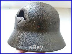WW2 Helmet of a German soldier damaged in battle, Eastern Front WWII