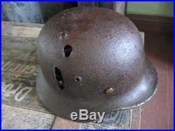 WW2 WWII German Wehrmacht helmet from Kurland. Battlefield damaged