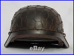 WW2 early German M40 luftwaffe helmet made by Q66 w. Half basket chicken wire