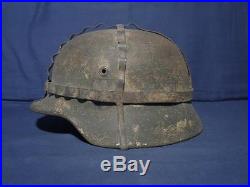 Ww2 German SD helmet. M-40. Size 64. Heer helmet. With camo net and white paint