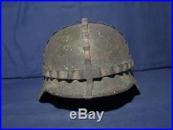 Ww2 German SD helmet. M-40. Size 64. Heer helmet. With camo net and white paint