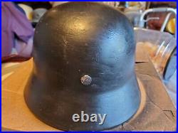 Ww2 M35 German helmet with liner and chinstrap stamped NS62